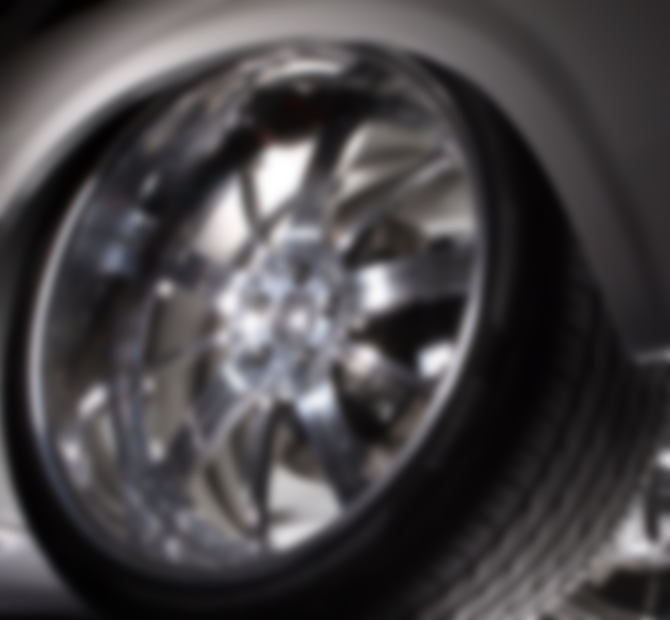 A close up of the rim and tire on a car